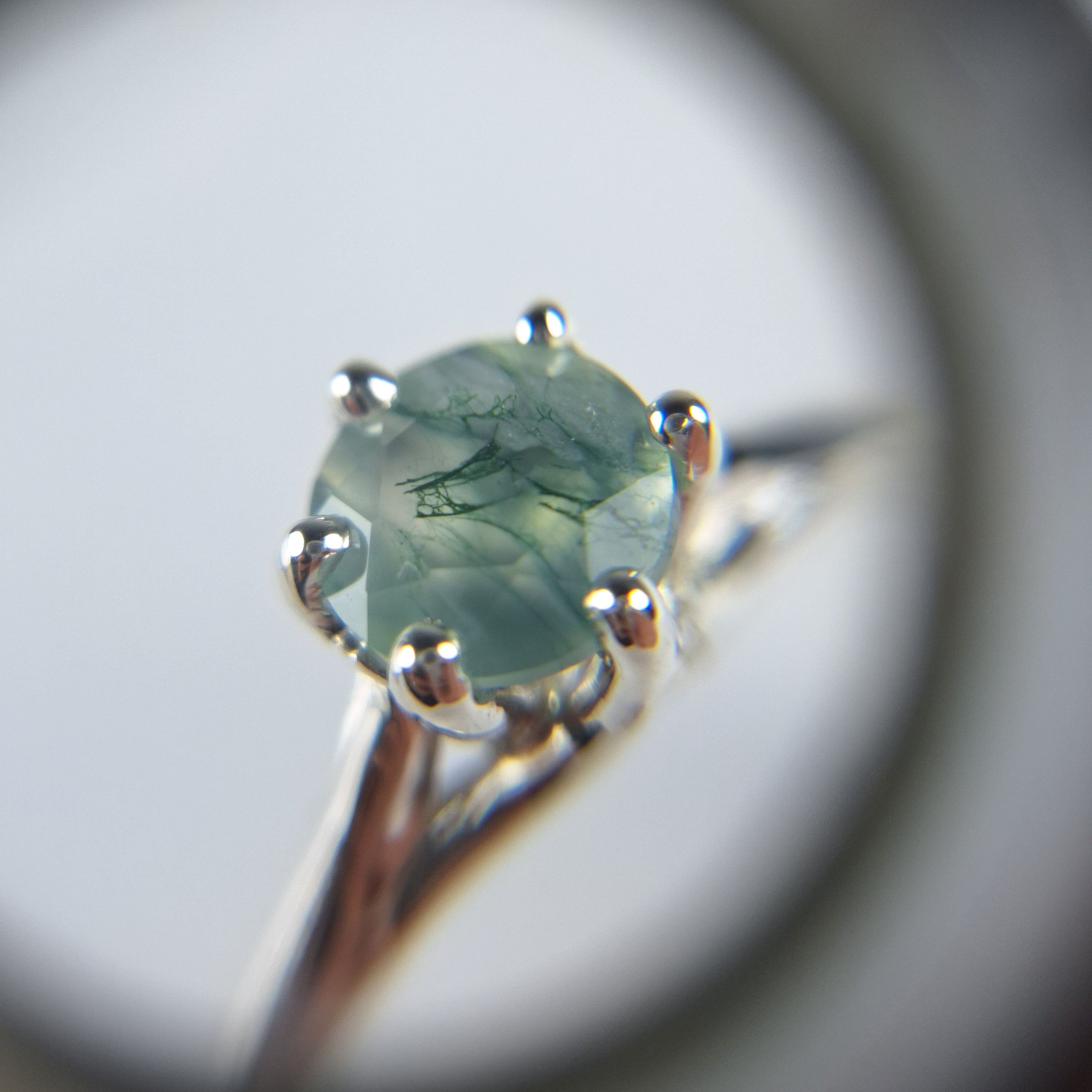 Close up of silver ring with moss agate