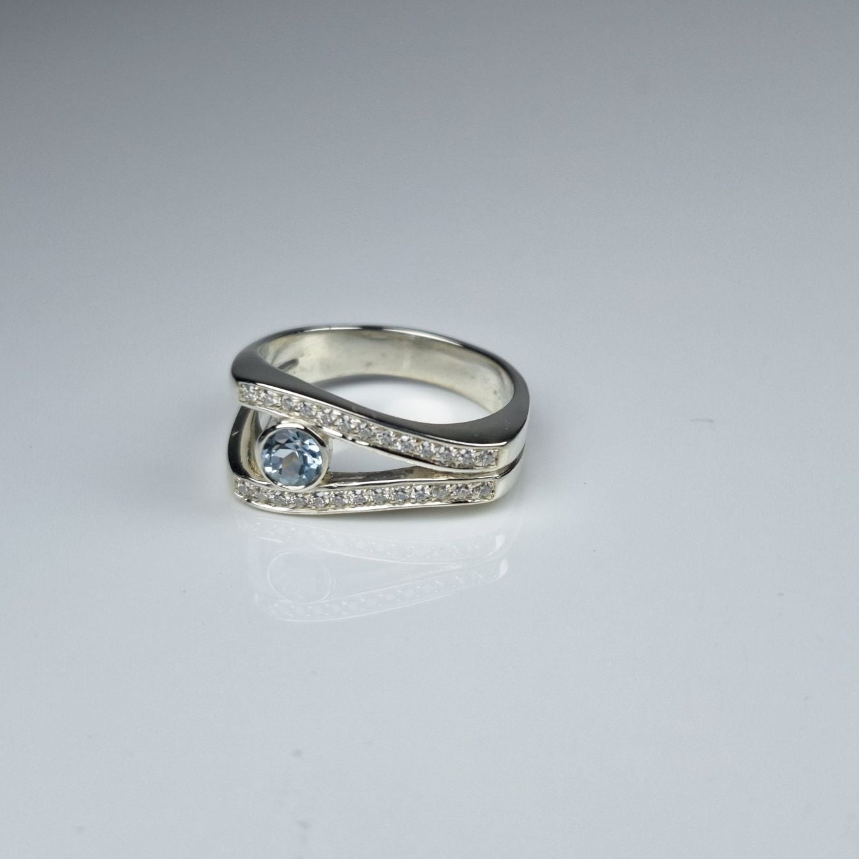Sky Blue Topaz and Moissanite Ring