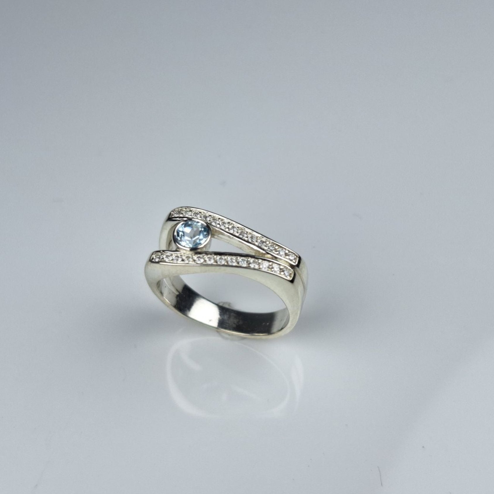 Sky Blue Topaz and Moissanite Ring