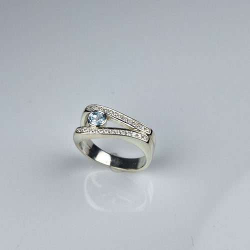 Sky Blue Topaz and Moissanite Ring