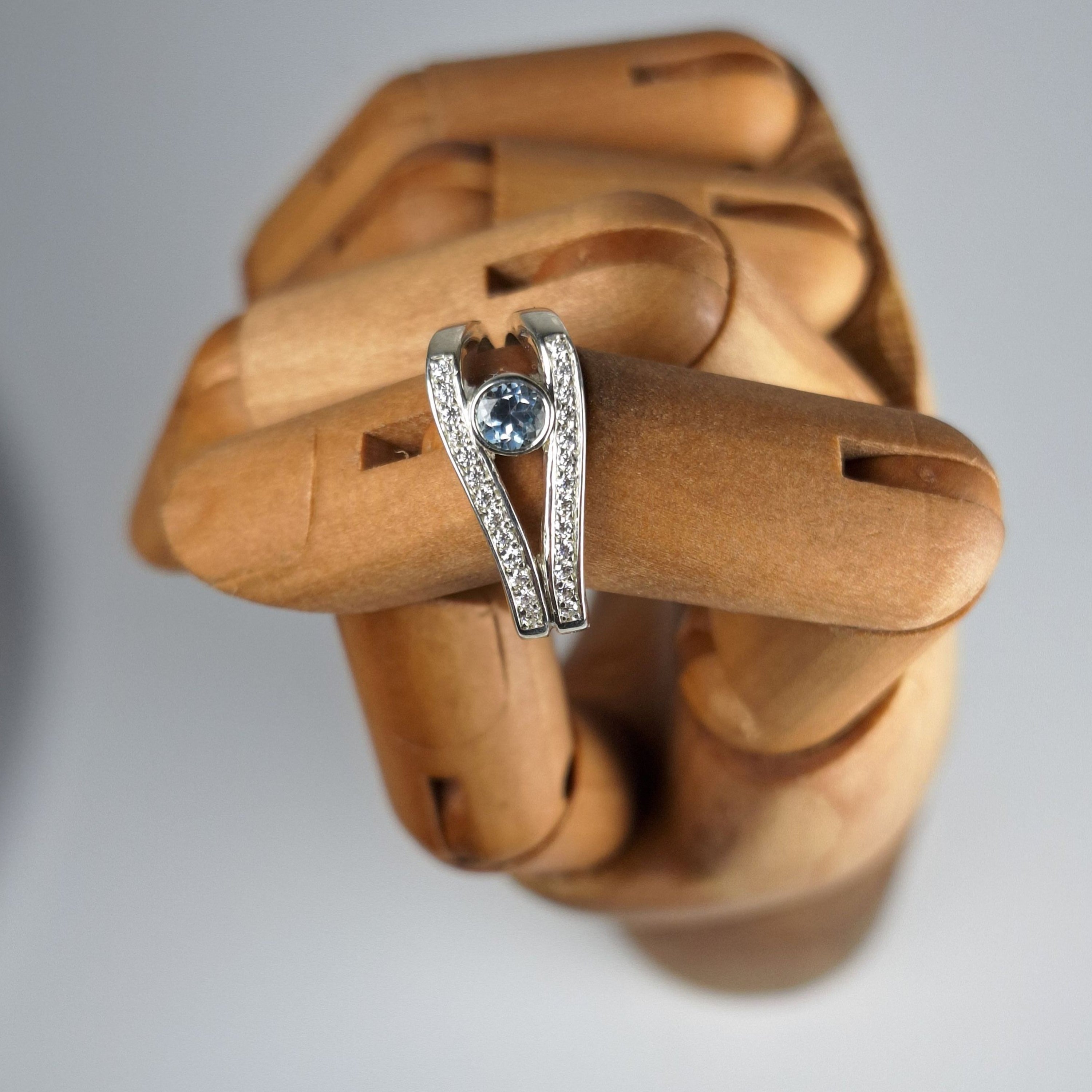 Sky Blue Topaz and Moissanite Ring