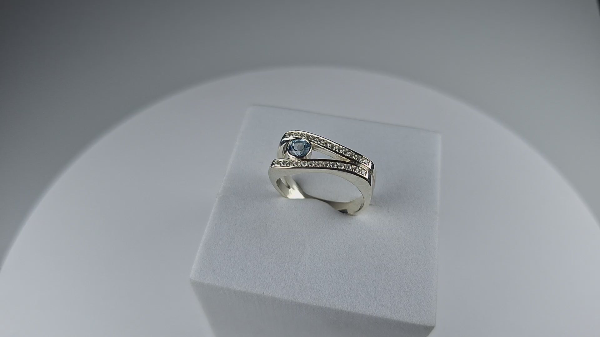 Sky Blue Topaz and Moissanite Ring